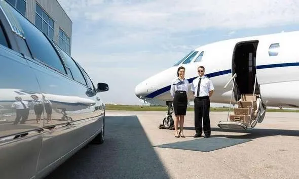 Luxury vehicle and private aircraft on an airport tarmac